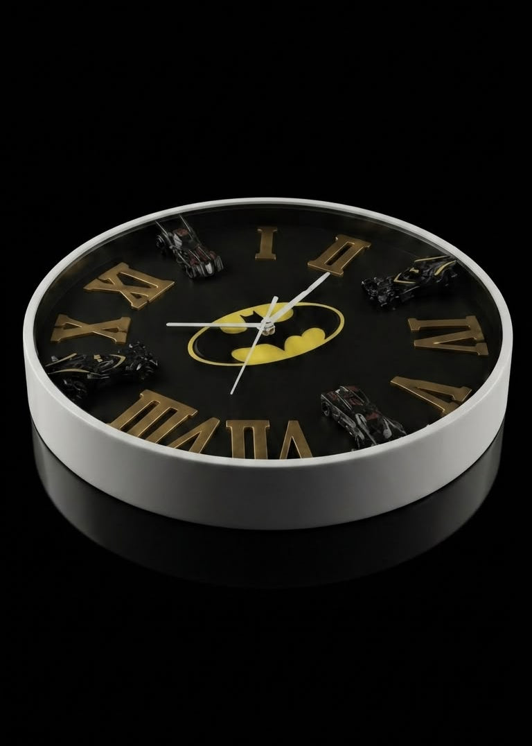 Batman-themed round wall clock with a black face, gold Roman numerals, a yellow bat symbol at the center, and dark bat-shaped hour markers, shown on a black background.